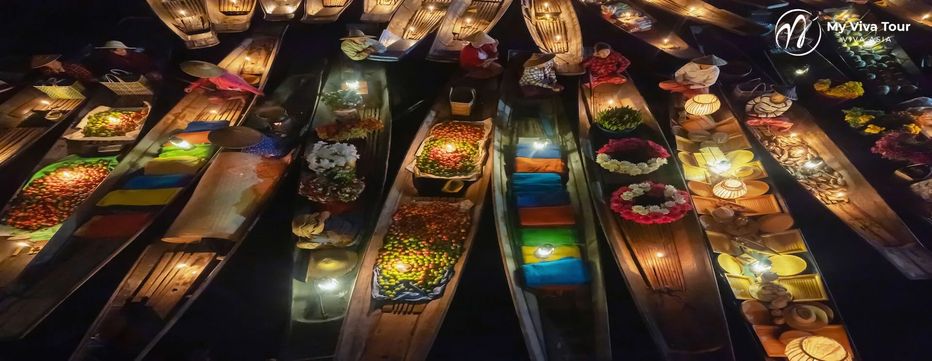 Aerial view of vendor boats laden with produce and flowers at Damnoen Saduak Floating Market near Bangkok, Thailand