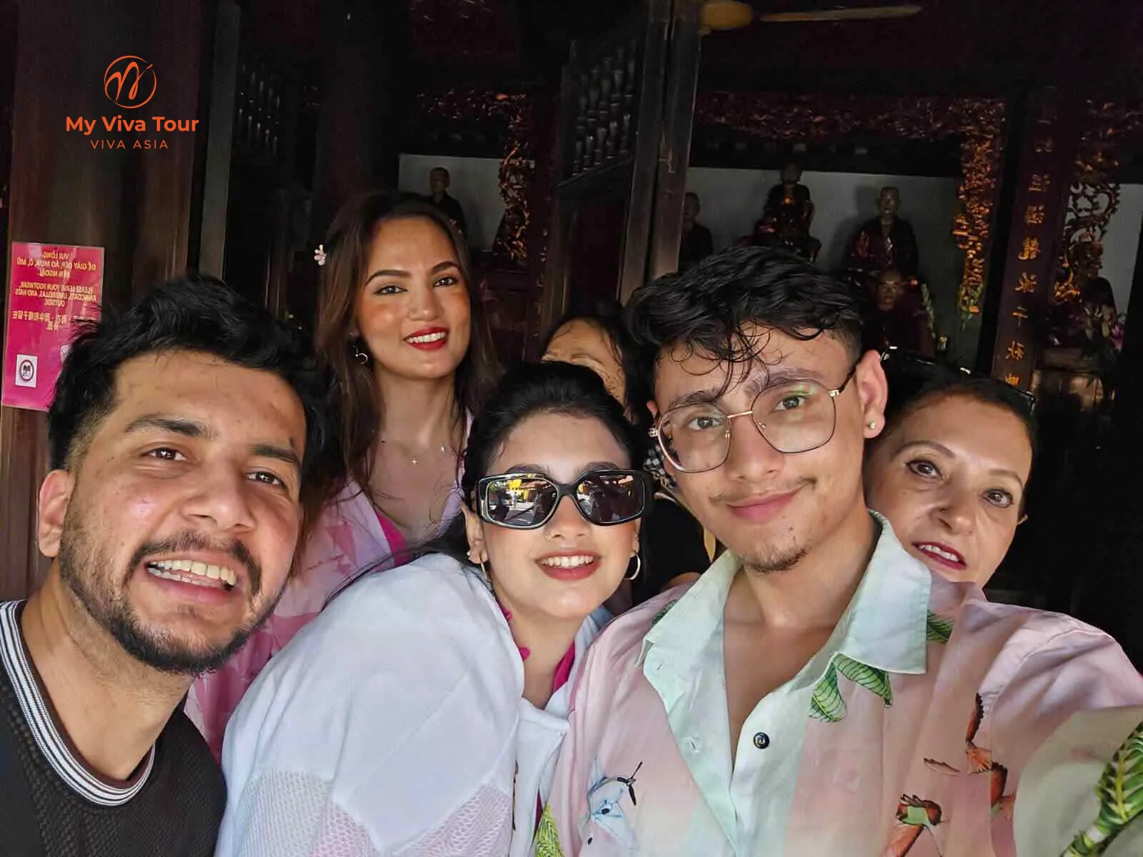 Family selfie inside a Hanoi temple during their Vietnam city tour
