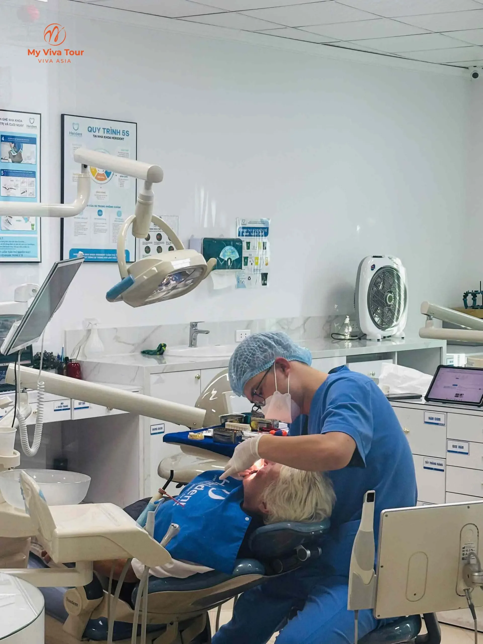 Dentist treating Karen Rooke during her Vietnam dental travel appointment in the clinic chair