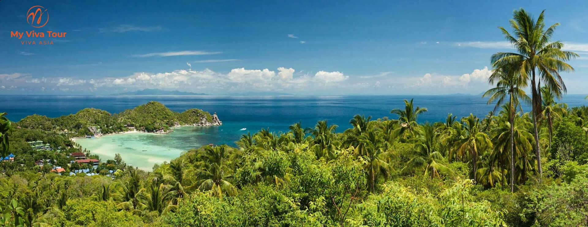 Palm-covered headland above a white-sand bay and clear turquoise sea from a viewpoint on Koh Samui, Thailand