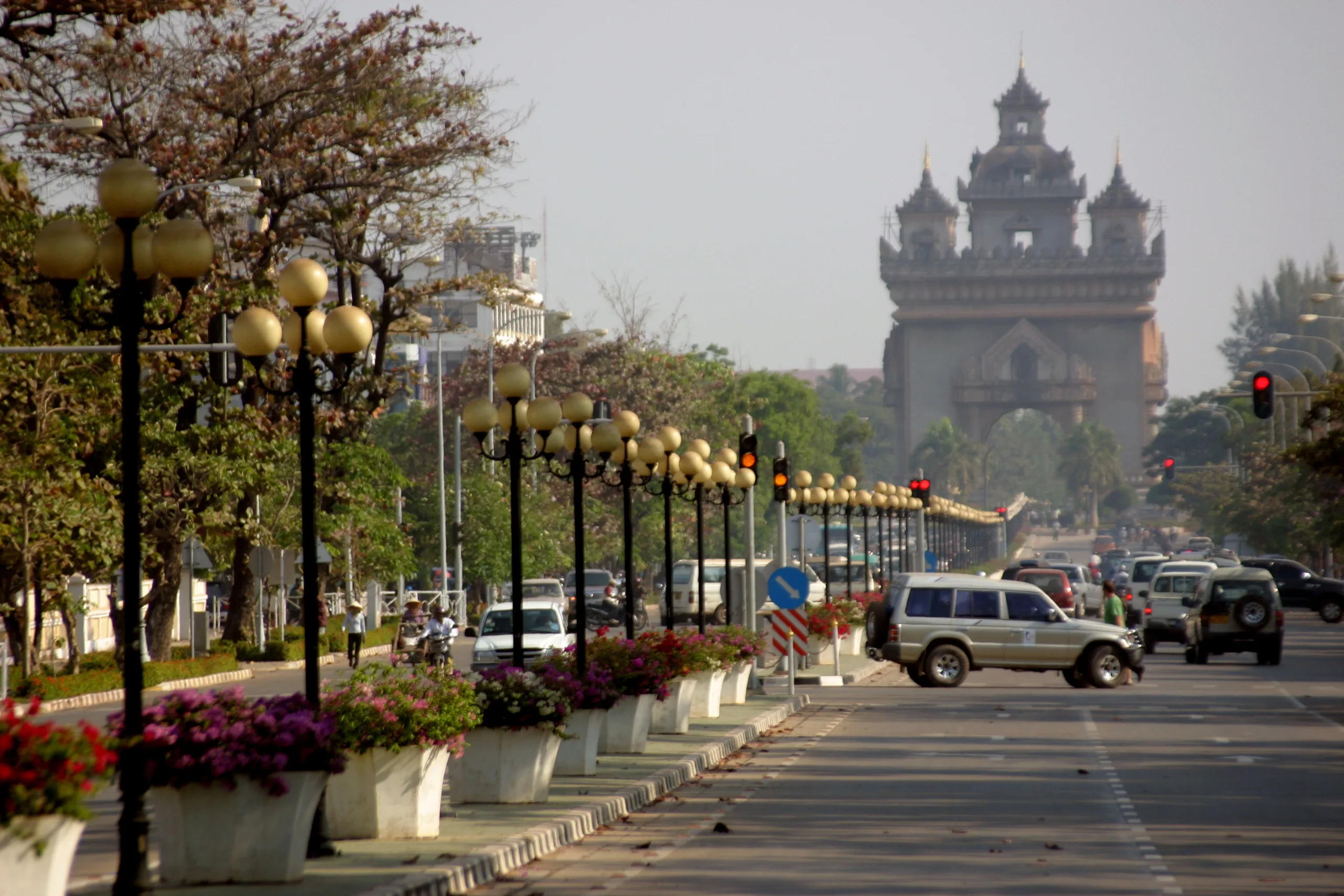 Patuxai Victory Monument at the end of a flower-lined boulevard in central Vientiane