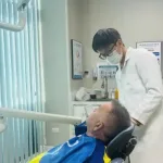 Vietnam dental travel patient Mr. Paul Logue with his confident new smile