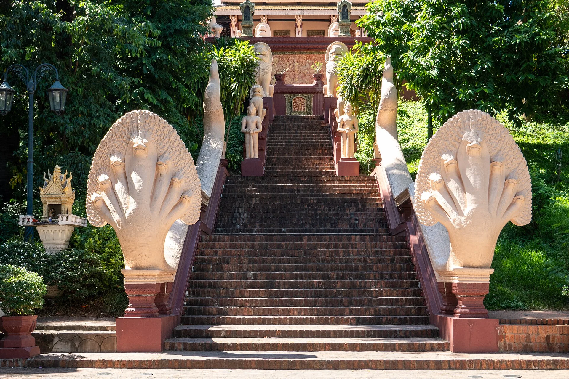 Naga serpent balustrades flanking the stone staircase up the hill to Wat Phnom temple in Phnom Penh