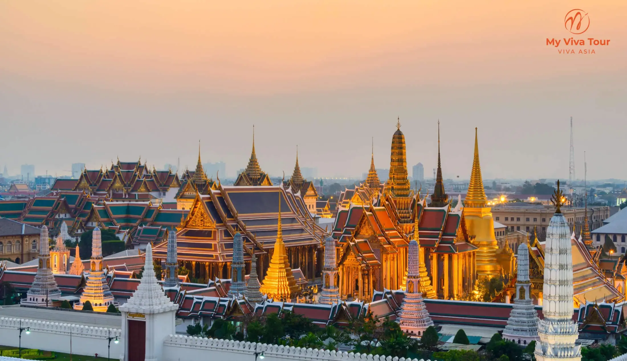 The Grand Palace and Wat Phra Kaew complex in Bangkok at sunset