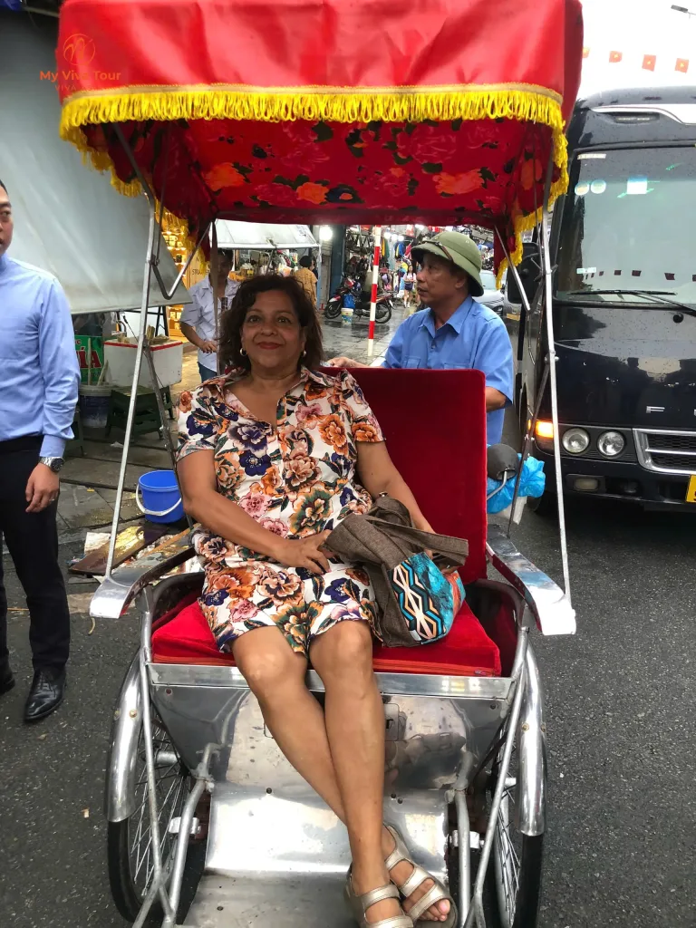 Guest on a cyclo ride through Hanoi's Old Quarter during her Vietnam and Thailand trip
