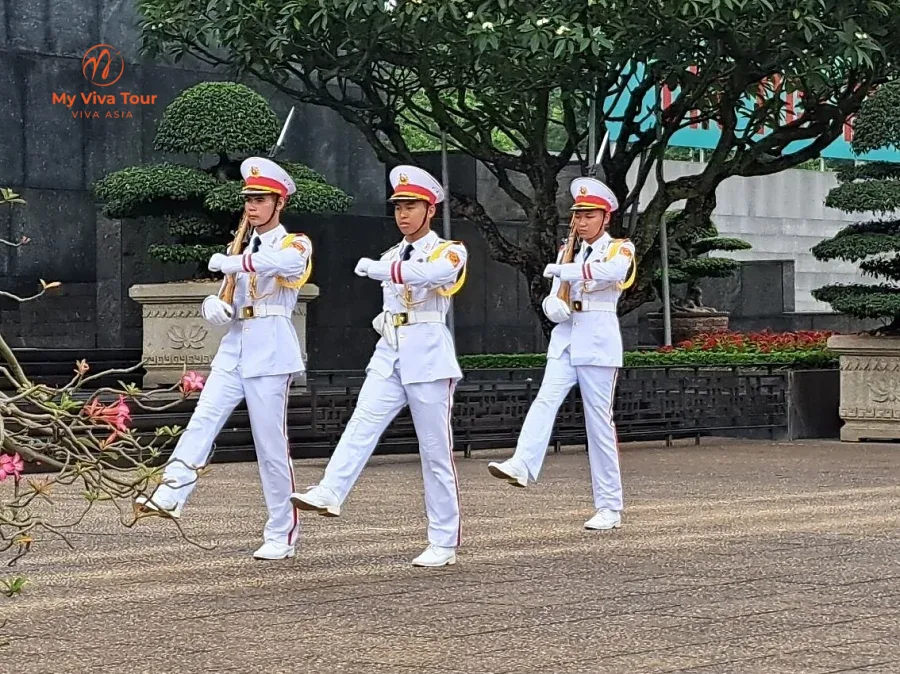 Ceremonial guards marching in white uniforms in Hanoi, Vietnam