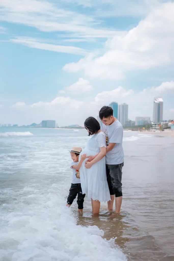 Family enjoying time together by the sea, a moment from a first family trip to Vietnam