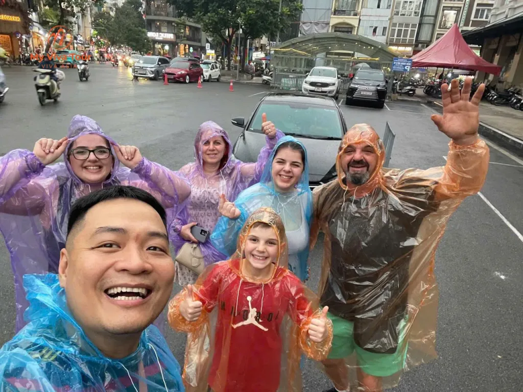 A family Vietnam trip carries on with laughter in rain ponchos, Hanoi