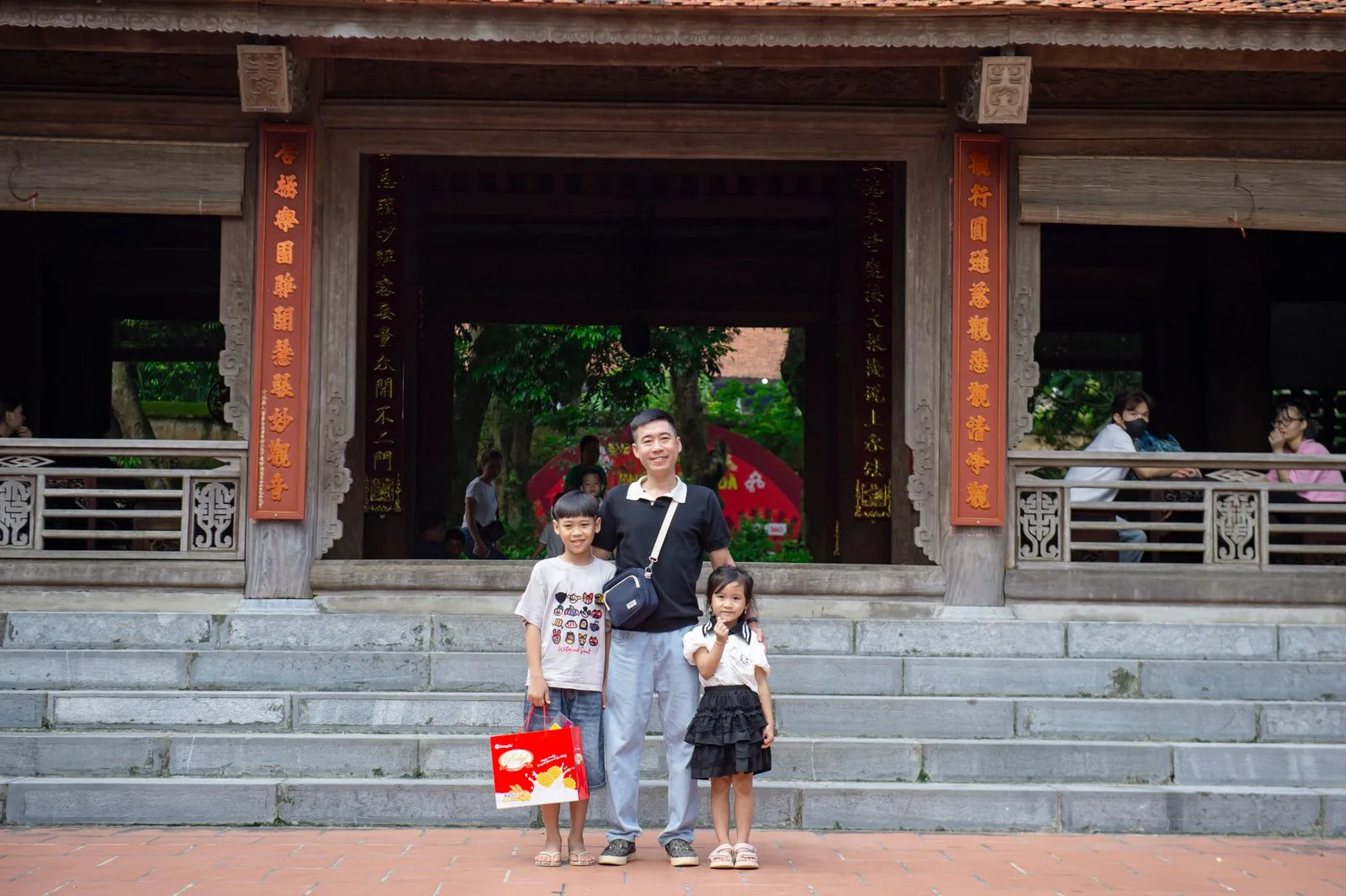 Family visiting a historic site during a Vietnam family holiday