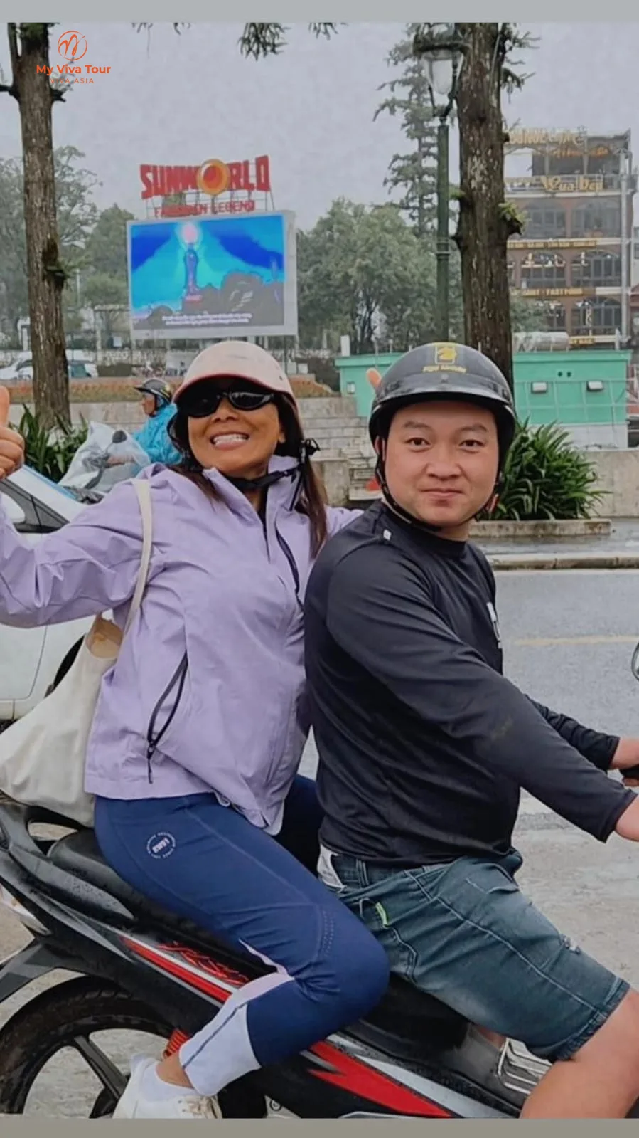 Farida on the back of a motorbike outside Sun World Fansipan Legend in Sapa