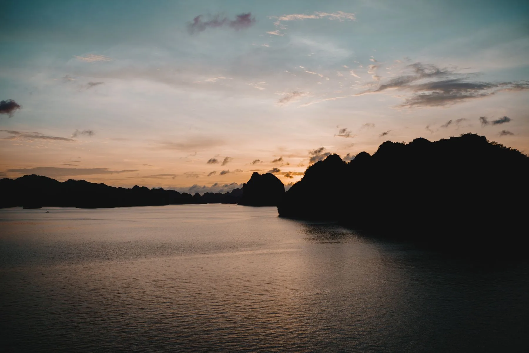 Sunset silhouette over Vietnam's coastline, a peaceful travel atmosphere shot