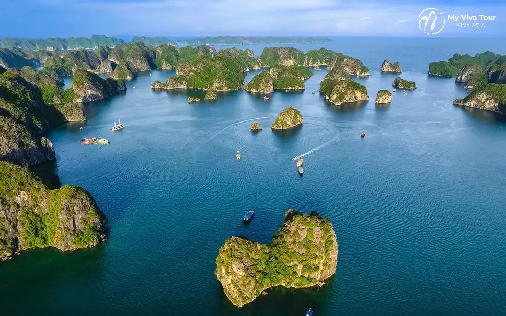 Vietnam and Thailand tours from the USA — aerial view of Ha Long Bay's limestone karsts and cruise boats