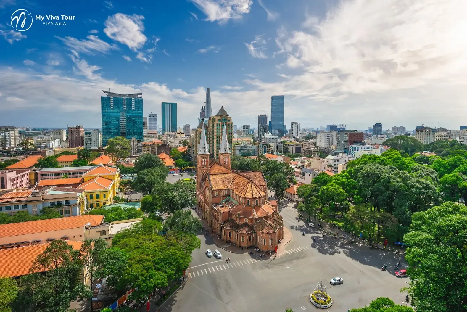 Notre-Dame Cathedral Basilica of Saigon against the Ho Chi Minh City skyline