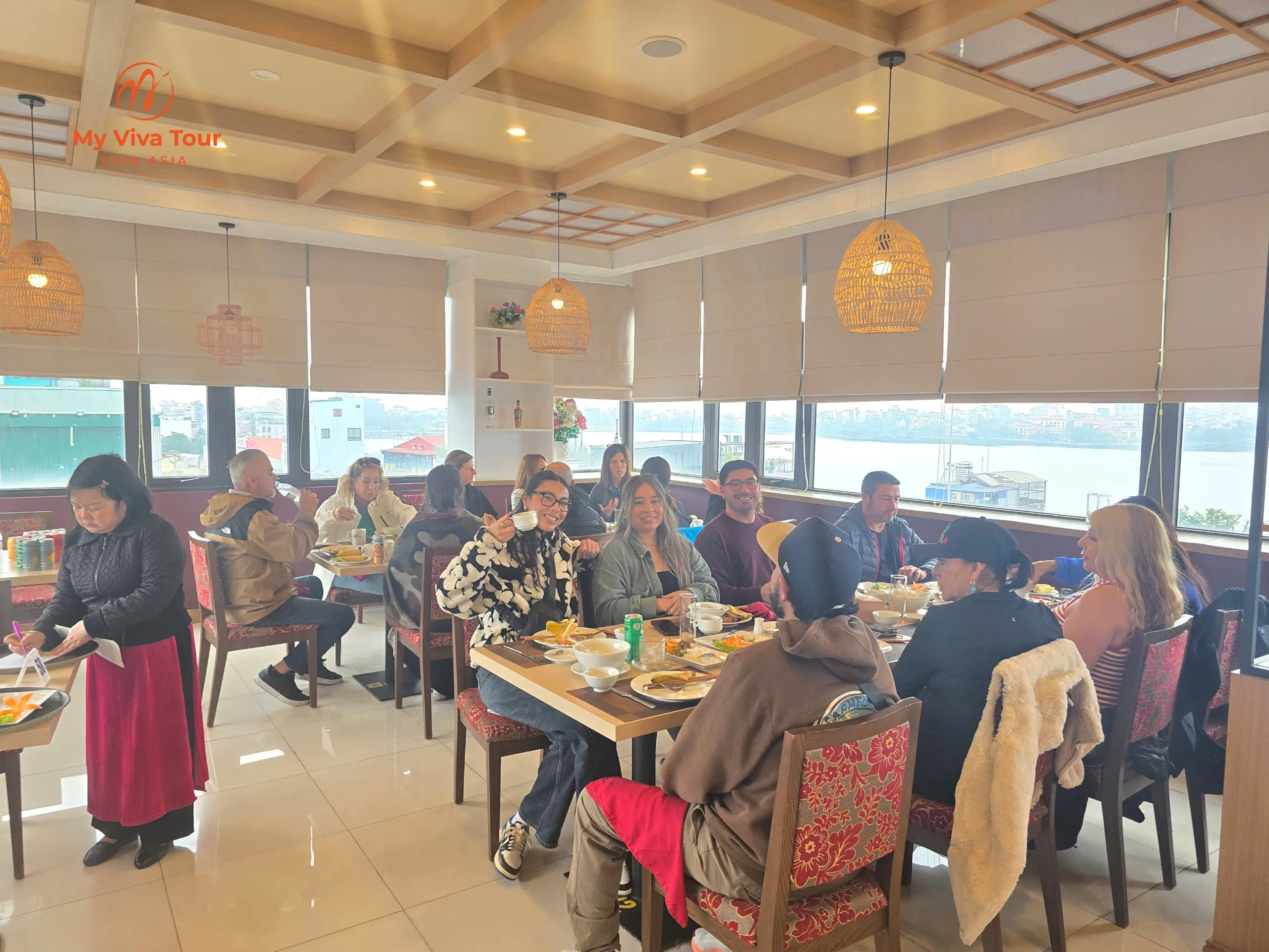 Patricia, Aida and the group sharing a lively breakfast at a lakeside restaurant in Hanoi