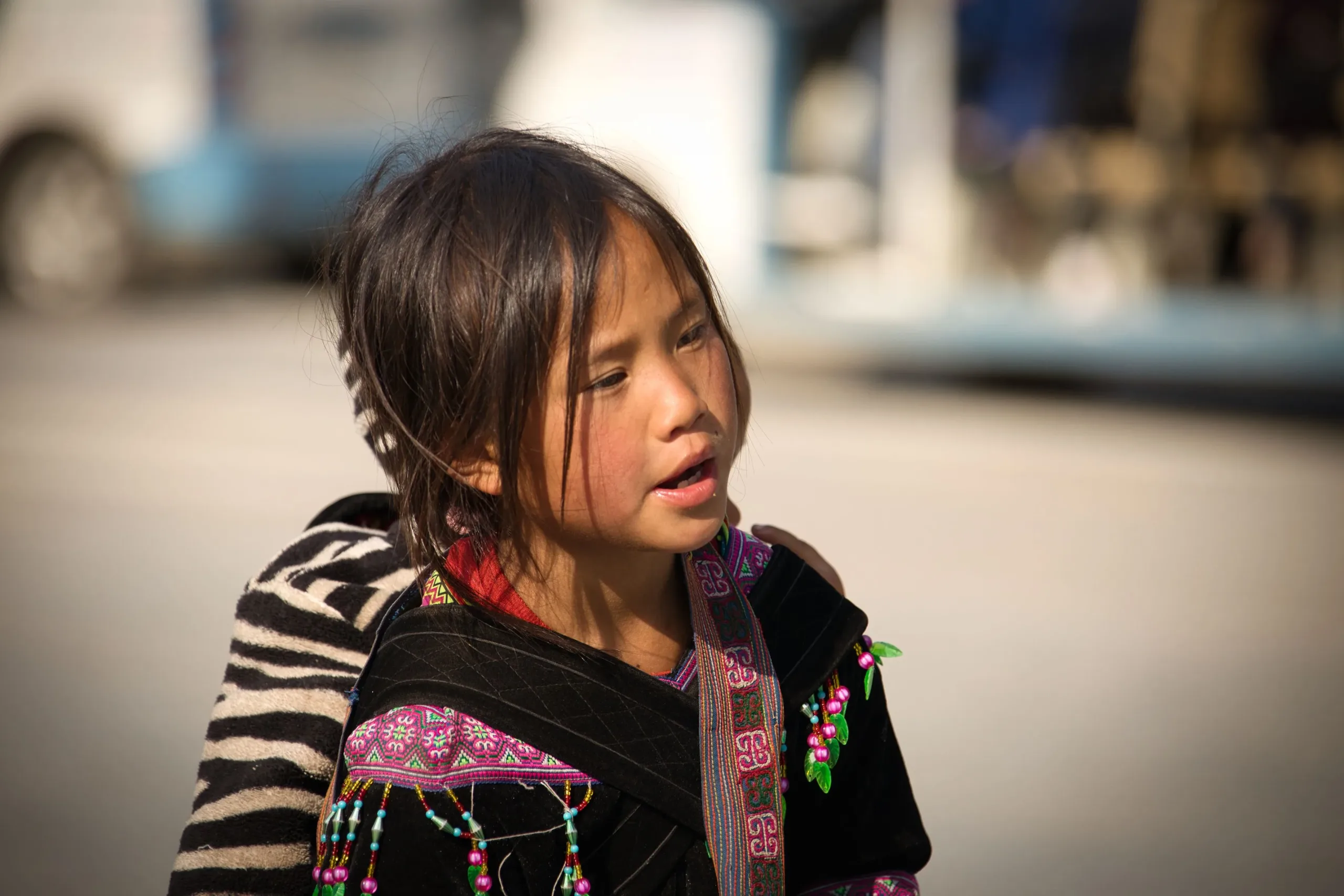 Young Hmong girl in traditional embroidered dress in the Sa Pa area