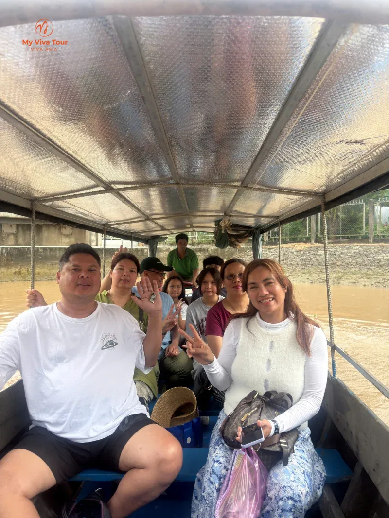 Jerome's group sharing a covered boat trip through the Mekong Delta, Vietnam