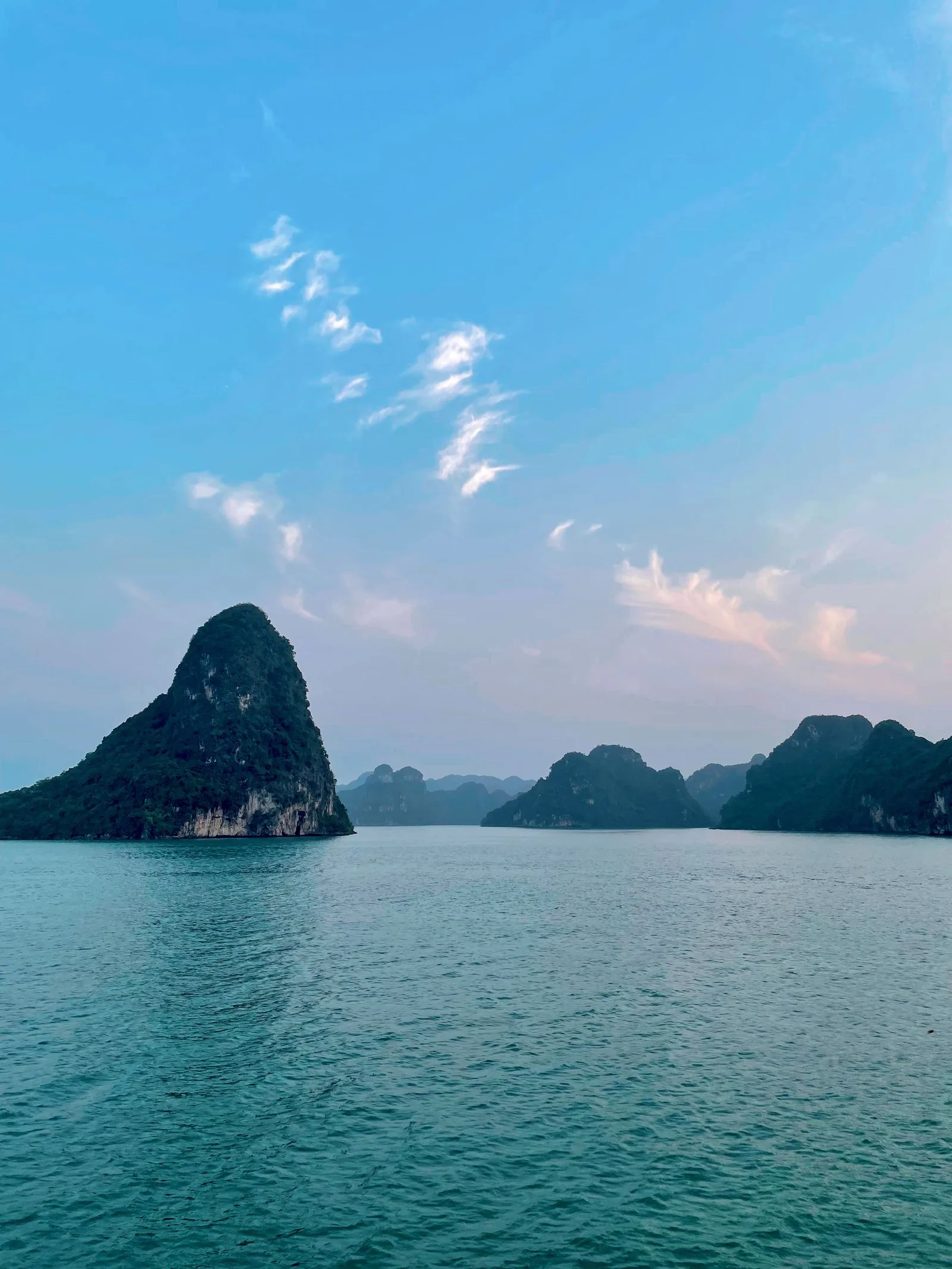 Sunset over limestone karst islands in Lan Ha Bay, part of the Ha Long Bay seascape