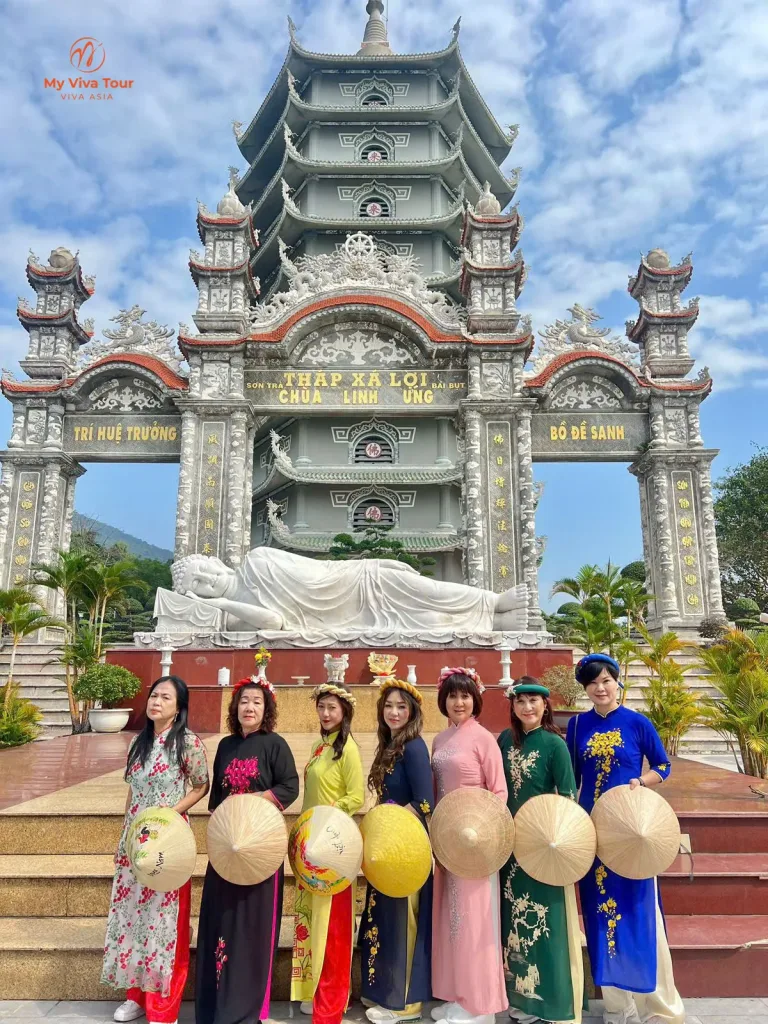 Seven friends in colourful ao dai and non la at the Linh Ung Pagoda ao dai photoshoot, Son Tra, Da Nang