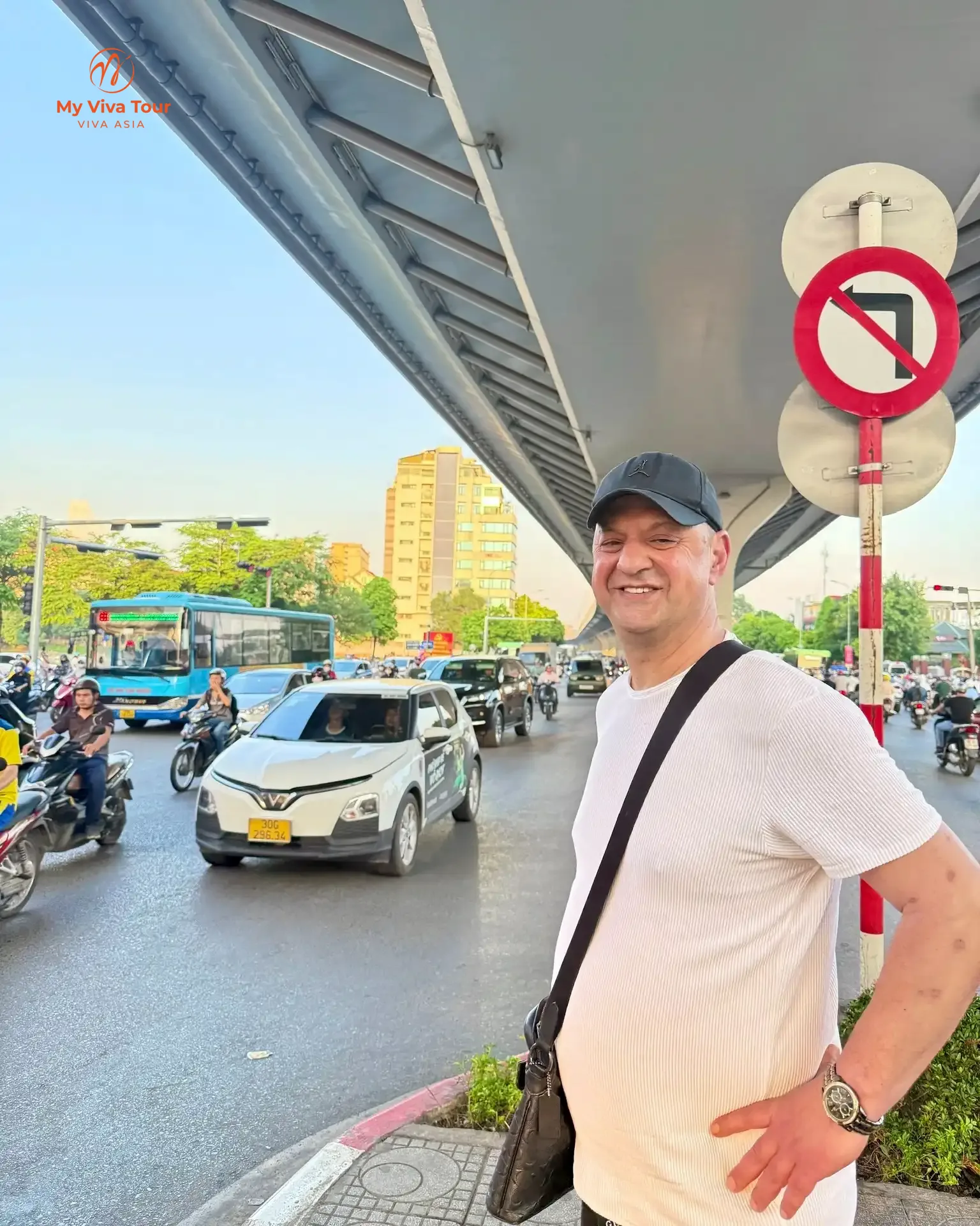 Ovidiu smiling on a busy Hanoi street between dental appointments