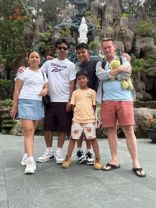 Santosh's family together at a pagoda rock garden in Da Nang, Vietnam