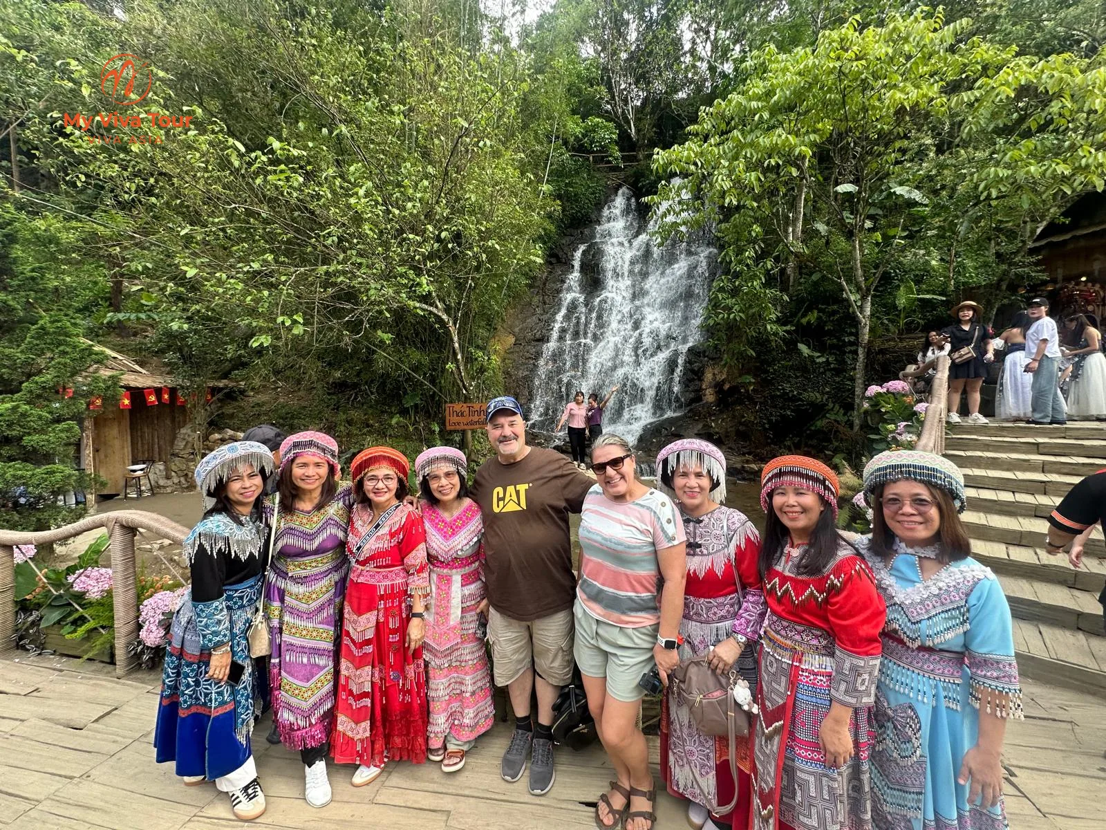 Travellers in traditional Hmong dress at Sapa's Love Waterfall