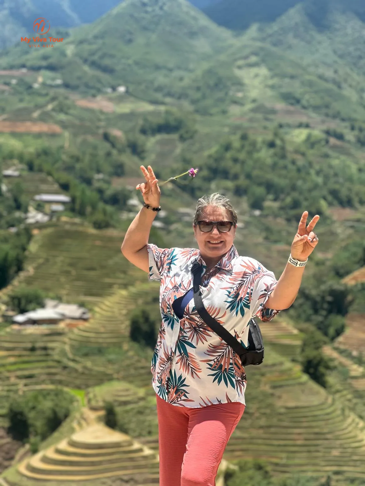 Traveller enjoying Sapa's terraced rice fields on a misty morning