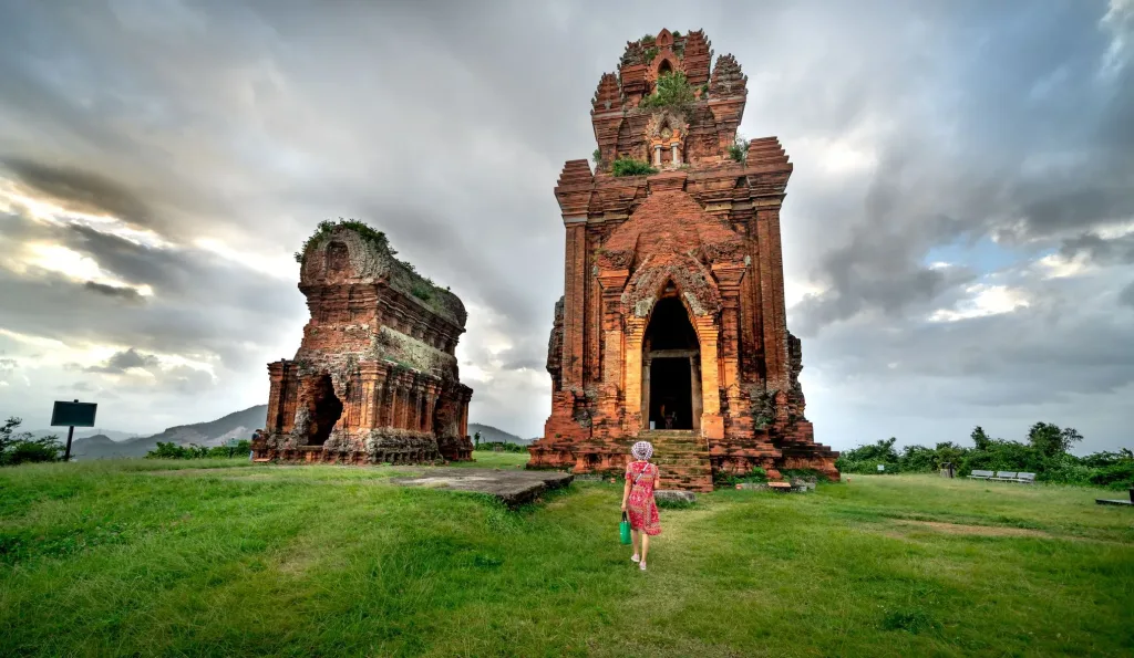 Solo traveller exploring ancient temple ruins on a solo trip to Vietnam