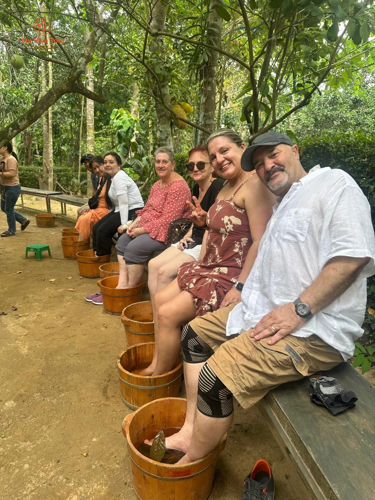 Group relaxing with a traditional foot soak on their Vietnam trip