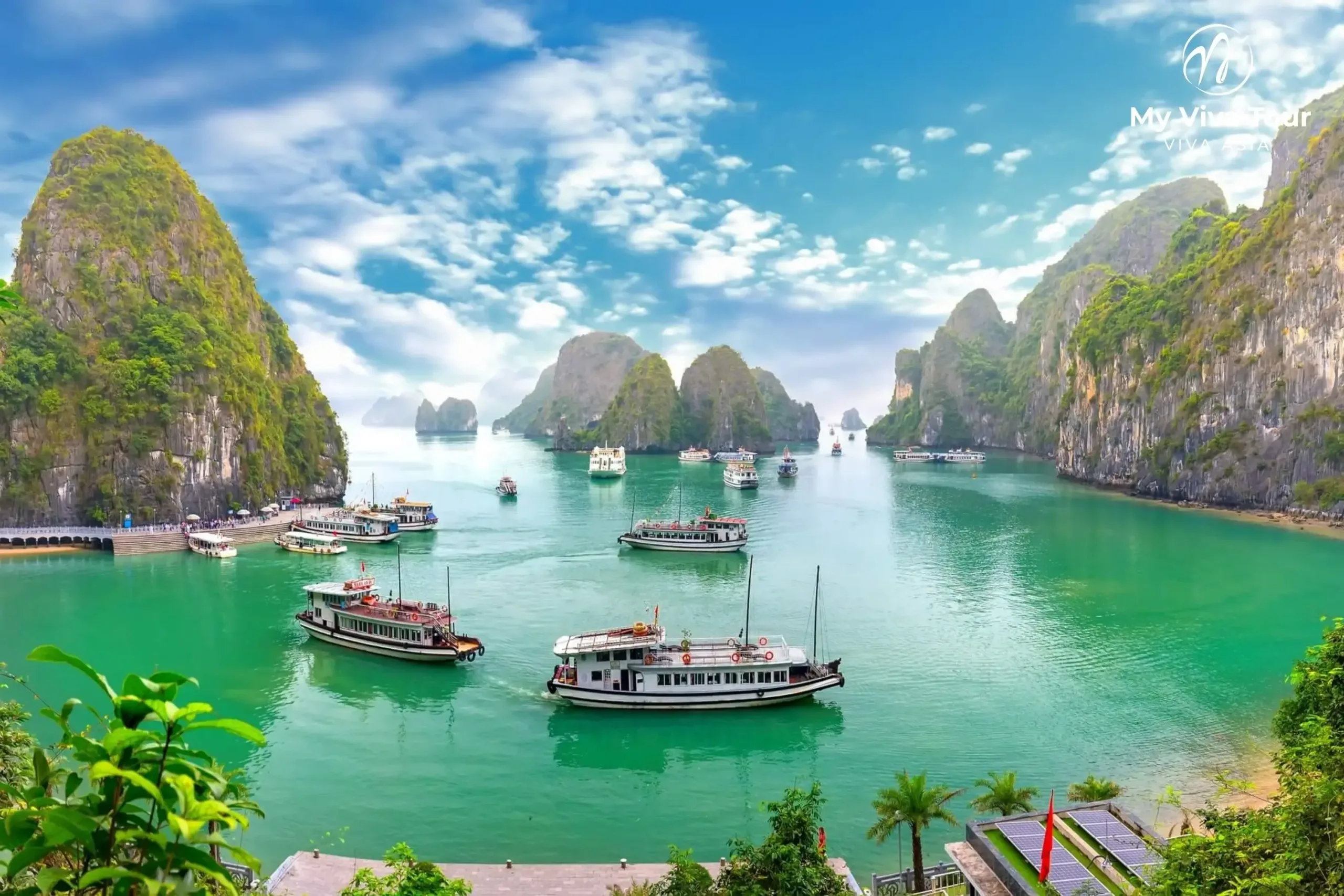 Vietnam tours from the UK — cruise boats among the limestone karsts of Ha Long Bay