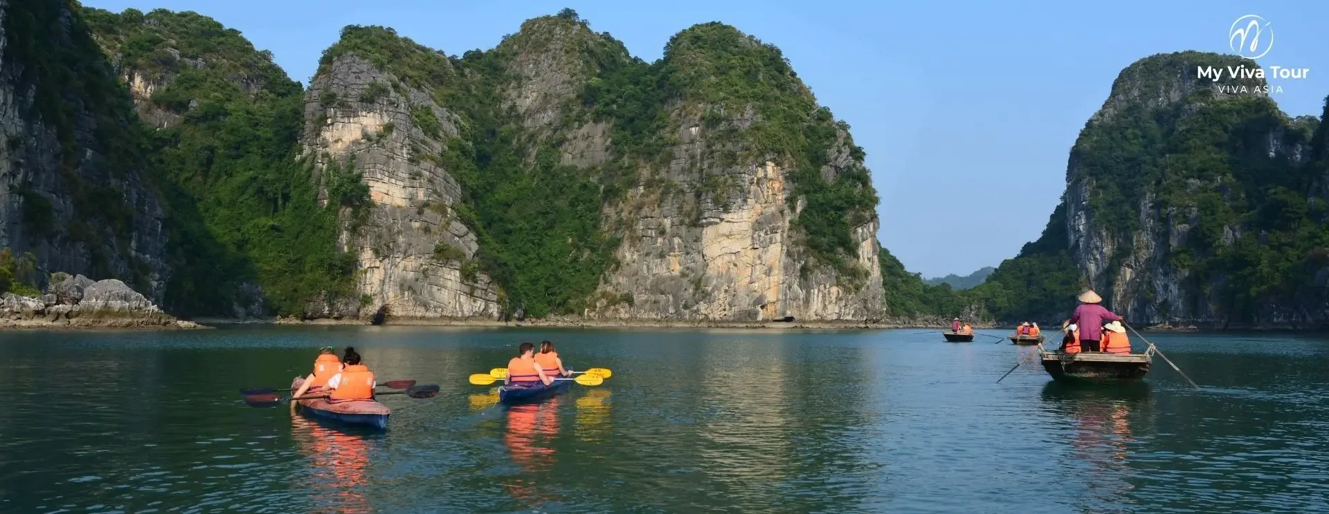 Vietnam and Thailand tours from the UK and Australia — tour boats cruising between the limestone karsts of Ha Long Bay, Vietnam