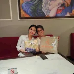 Vietnam itinerary for couples: My Viva Tour welcome gifts handed over in the Hanoi hotel lobby
