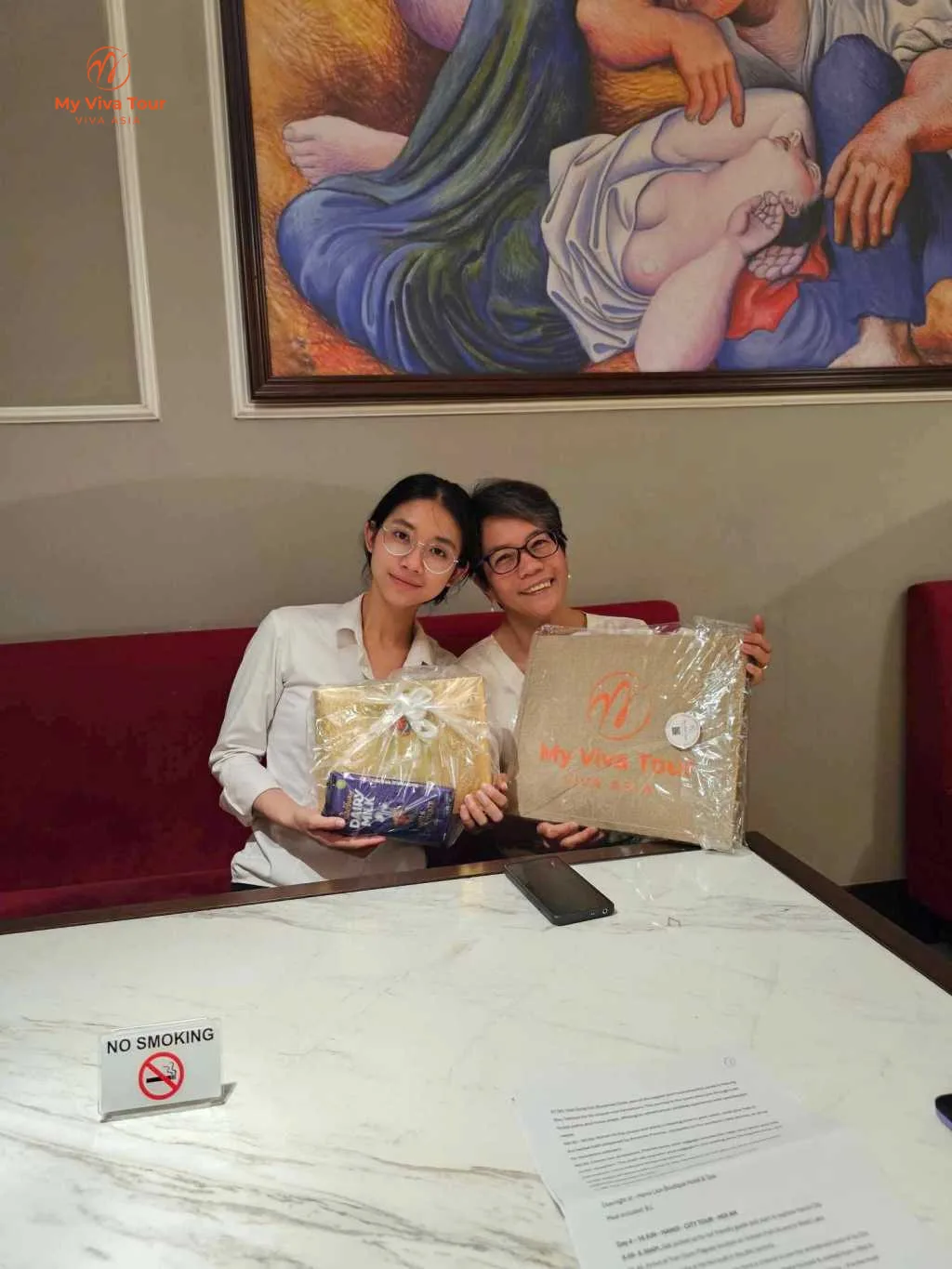 Vietnam itinerary for couples: My Viva Tour welcome gifts handed over in the Hanoi hotel lobby