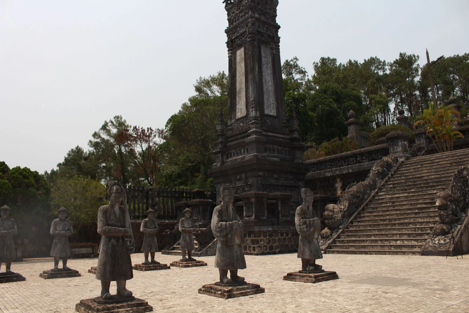 Rows of stone mandarin statues standing guard in the honour courtyard of the Khai Dinh royal tomb near Hue