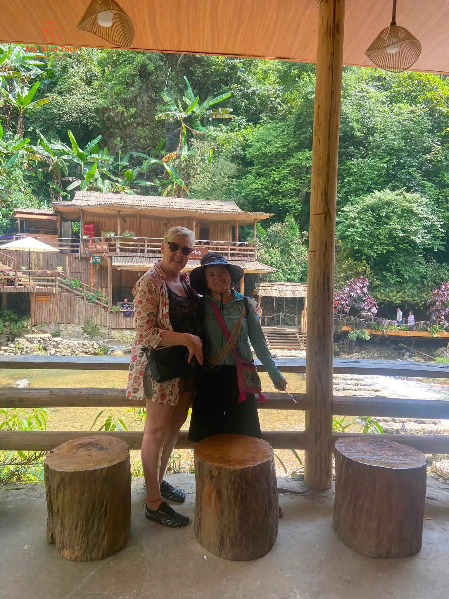 Wooden stilt houses beside the stream at Cat Cat village, Sapa