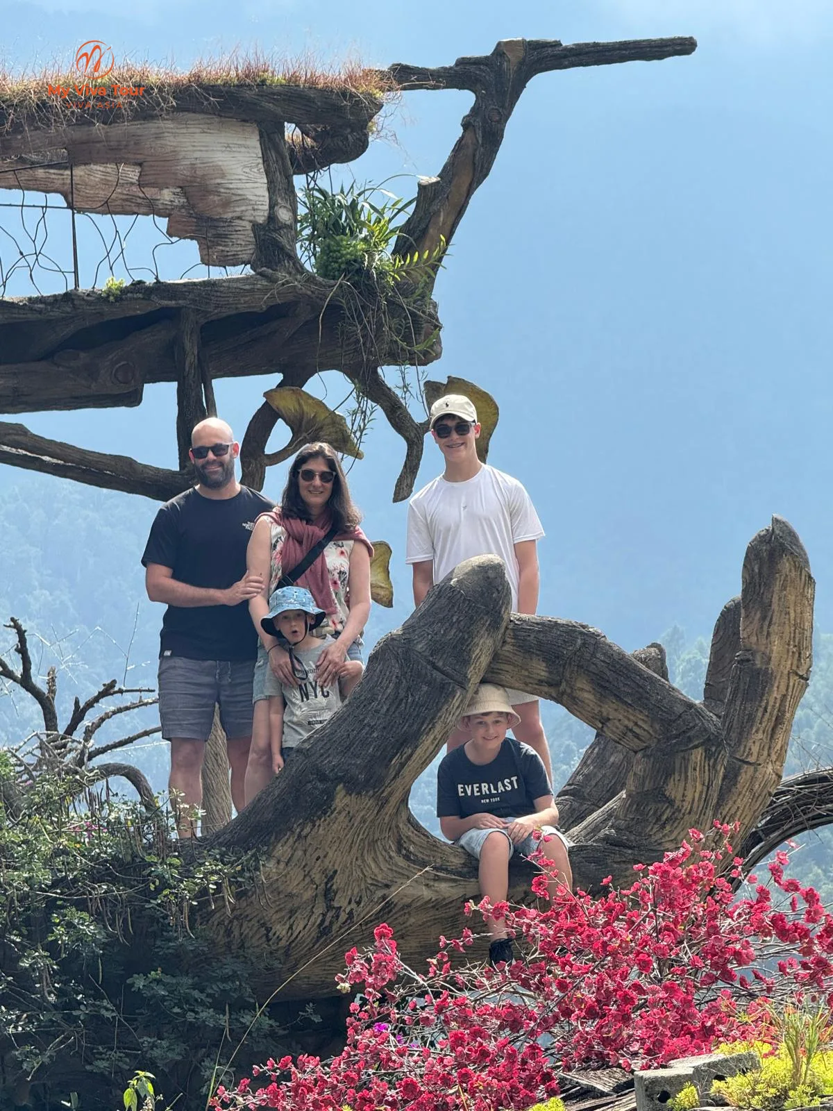 The Dana family at a mountain viewpoint on their family trip to Sapa, Vietnam