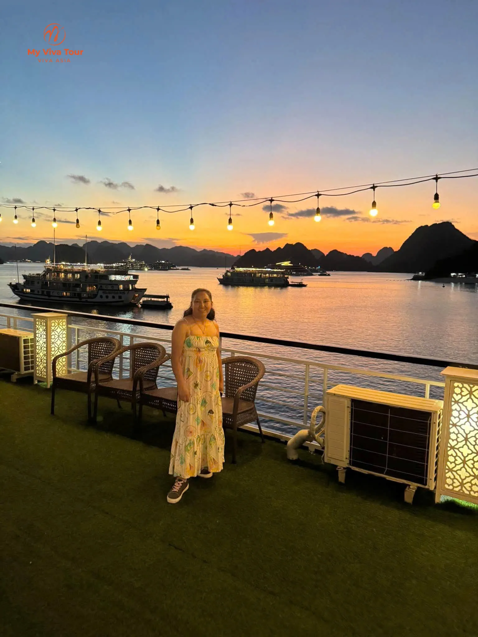 Sunset over the karsts of Ha Long Bay seen from the deck of an overnight cruise