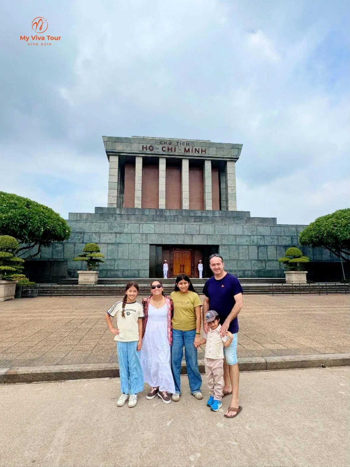 Family in front of the Ho Chi Minh Mausoleum in Hanoi
