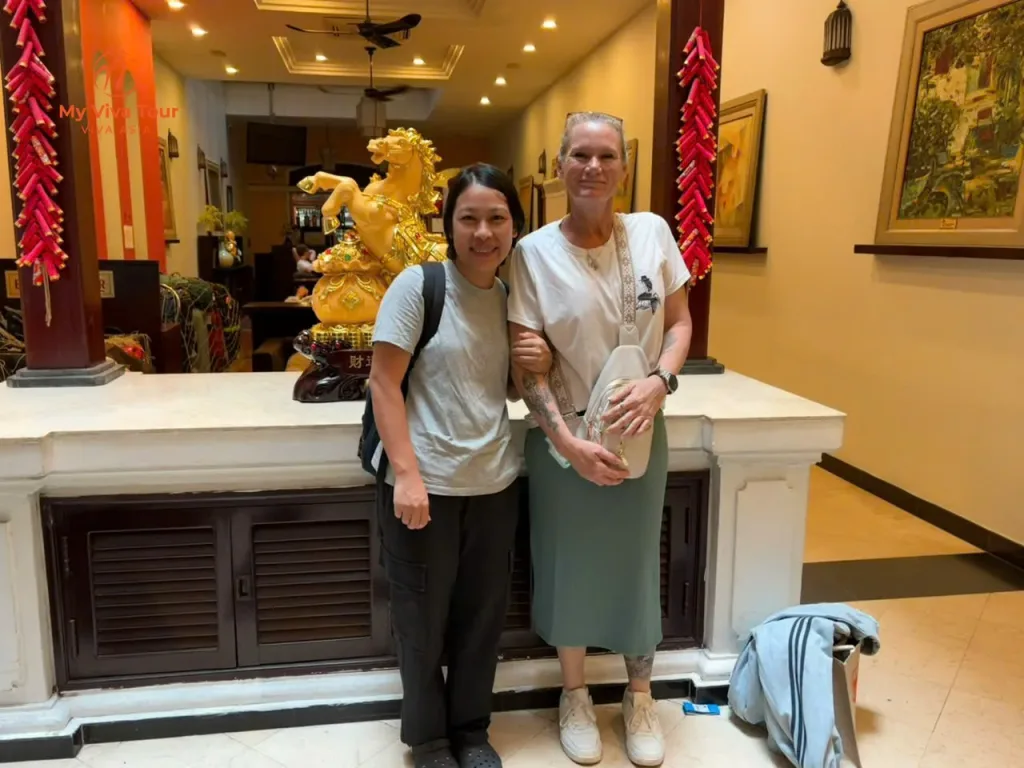 Demelza with one of the My Viva Tour team in a hotel lobby during her Ha Long Bay and Hoi An trip
