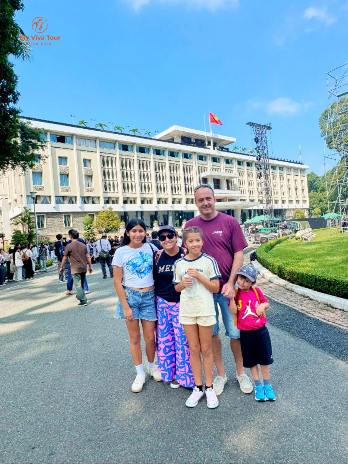 Family of five outside the Reunification Palace in Ho Chi Minh City